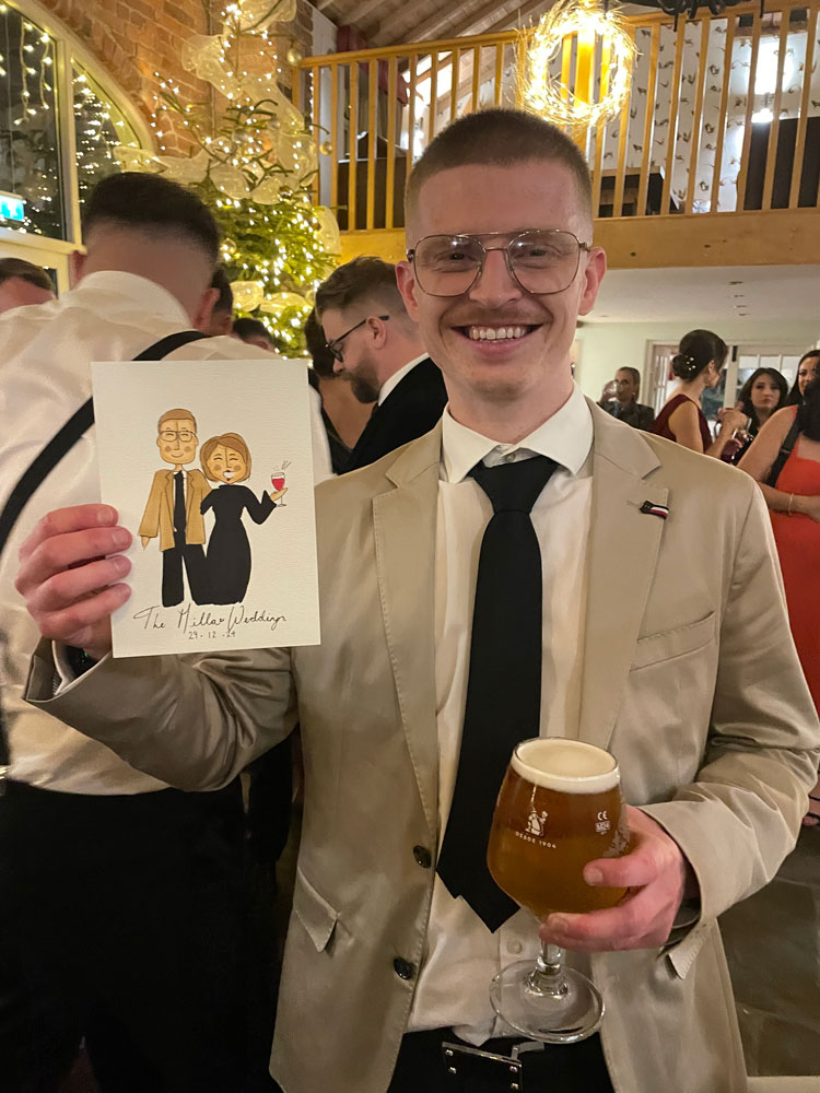 guest proudly showing his illustration drawn by hannah
